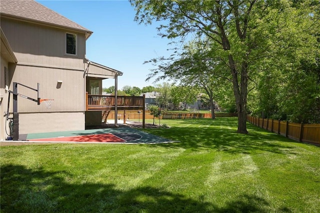 7419 Constance St, Shawnee, KS 66216 - view of yard featuring basketball hoop and a wooden deck