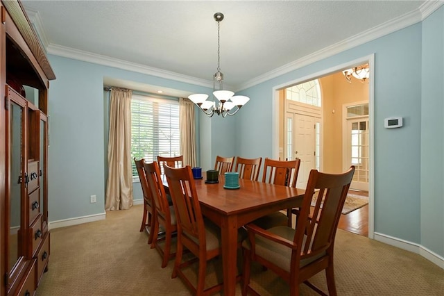 7419 Constance St, Shawnee, KS 66216 - dining space with a chandelier, ornamental molding, light carpet, and baseboards