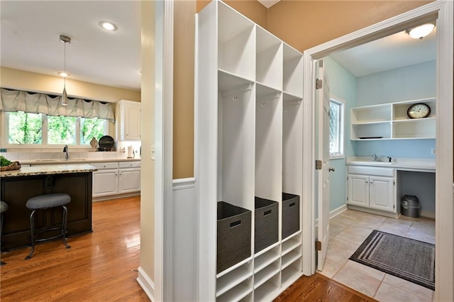 7419 Constance St, Shawnee, KS 66216 - mudroom featuring a sink and light wood-type flooring