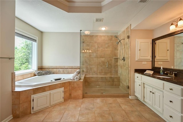 7419 Constance St, Shawnee, KS 66216 - full bath featuring a bath, vanity, ornamental molding, a shower stall, and tile patterned flooring