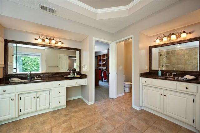 7419 Constance St, Shawnee, KS 66216 - full bath featuring vanity, a tile shower, toilet, crown molding, and a tray ceiling