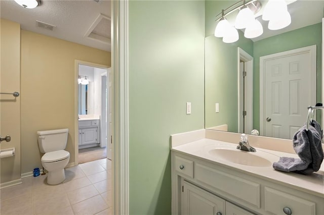 7419 Constance St, Shawnee, KS 66216 - bathroom featuring vanity, toilet, tile patterned flooring, and baseboards