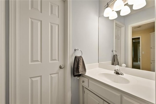 7419 Constance St, Shawnee, KS 66216 - bathroom featuring vanity and a chandelier