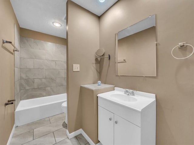 bathroom with toilet, baseboards, shower / washtub combination, and vanity