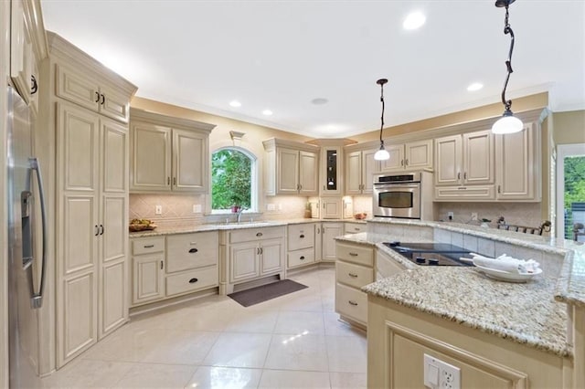 kitchen with appliances with stainless steel finishes, cream cabinetry, crown molding, backsplash, and light stone countertops