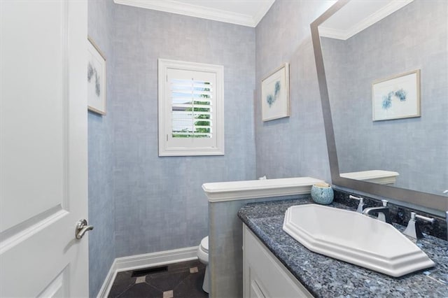 bathroom featuring ornamental molding, baseboards, toilet, and vanity