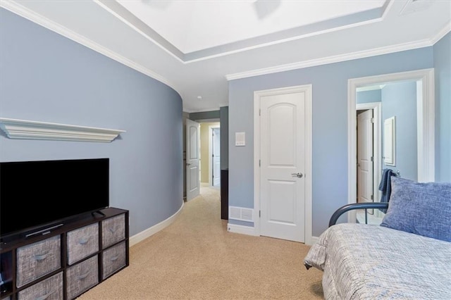 carpeted bedroom featuring ornamental molding and baseboards