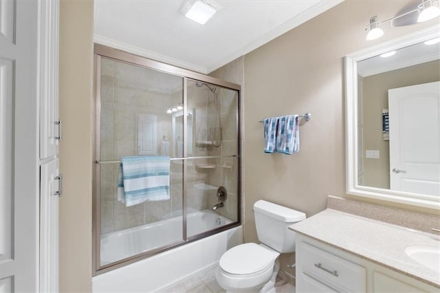 full bath featuring crown molding, vanity, toilet, and shower / bath combination with glass door