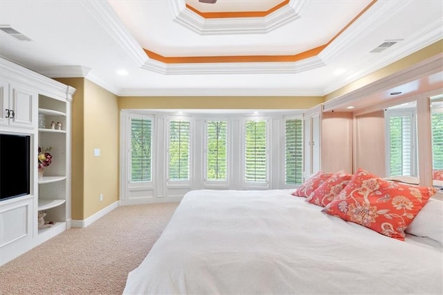 bedroom with crown molding, multiple windows, carpet floors, a tray ceiling, and recessed lighting