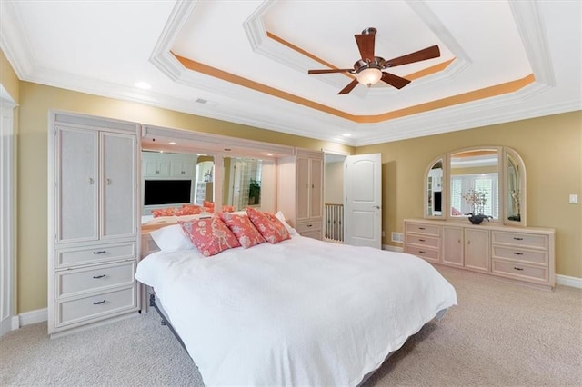bedroom featuring a raised ceiling, ornamental molding, light carpet, recessed lighting, and ceiling fan