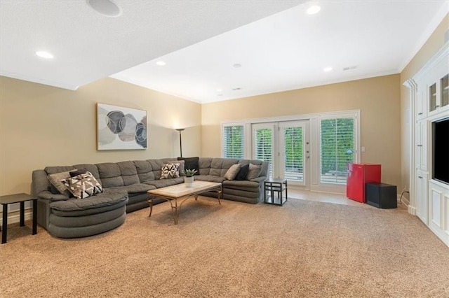living area with carpet, recessed lighting, and ornamental molding