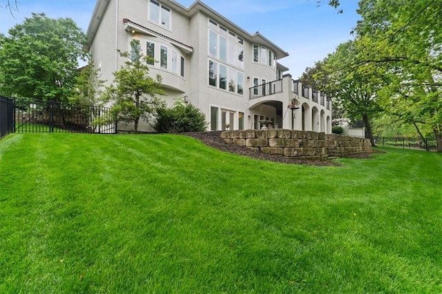 rear view of house with stucco siding