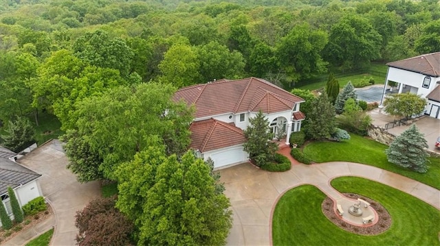 view of subject property with a heavily wooded area