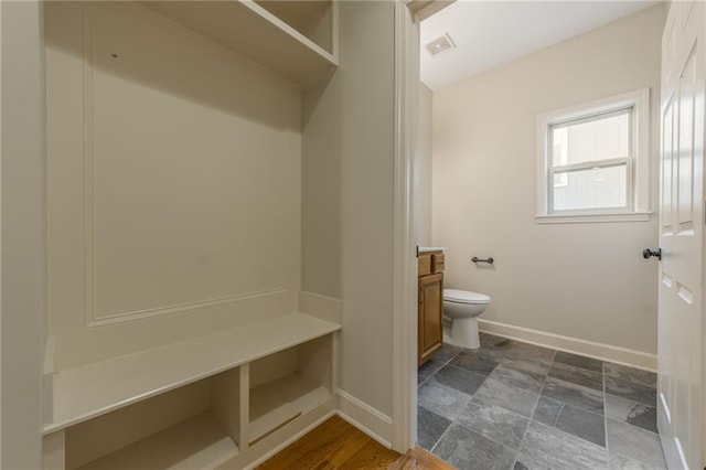 875 Clearview Dr, Lansing, KS 66043 - mudroom with baseboards and dark stone finish flooring