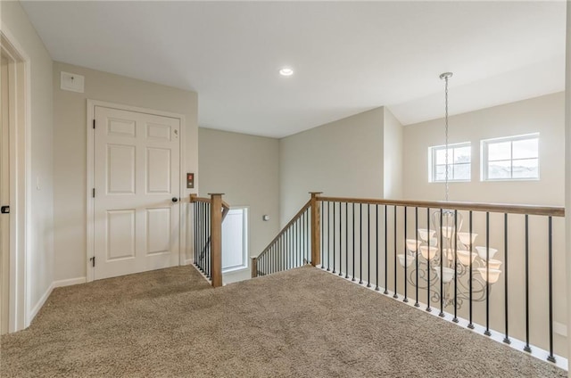 875 Clearview Dr, Lansing, KS 66043 - carpeted spare room featuring a chandelier and recessed lighting
