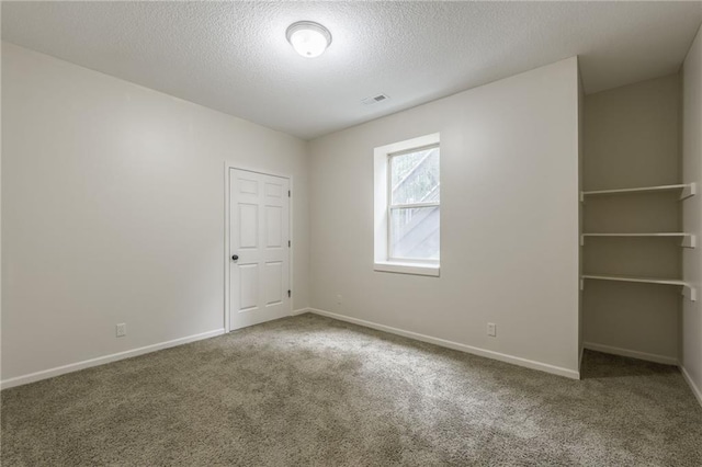 875 Clearview Dr, Lansing, KS 66043 - unfurnished room featuring carpet and a textured ceiling