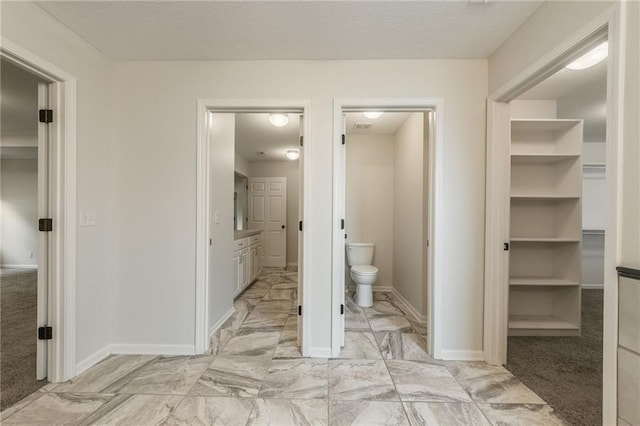 875 Clearview Dr, Lansing, KS 66043 - bathroom featuring toilet and marble look tiles