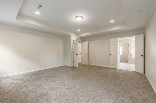 875 Clearview Dr, Lansing, KS 66043 - empty room with ornamental molding, a tray ceiling, light carpet, and recessed lighting