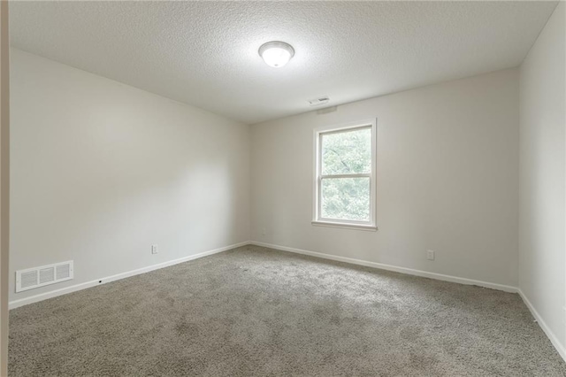 875 Clearview Dr, Lansing, KS 66043 - empty room with carpet floors and a textured ceiling