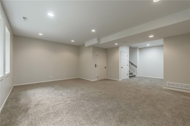875 Clearview Dr, Lansing, KS 66043 - unfurnished room with light colored carpet, recessed lighting, and stairs