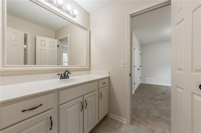 875 Clearview Dr, Lansing, KS 66043 - bathroom with vanity and a textured ceiling