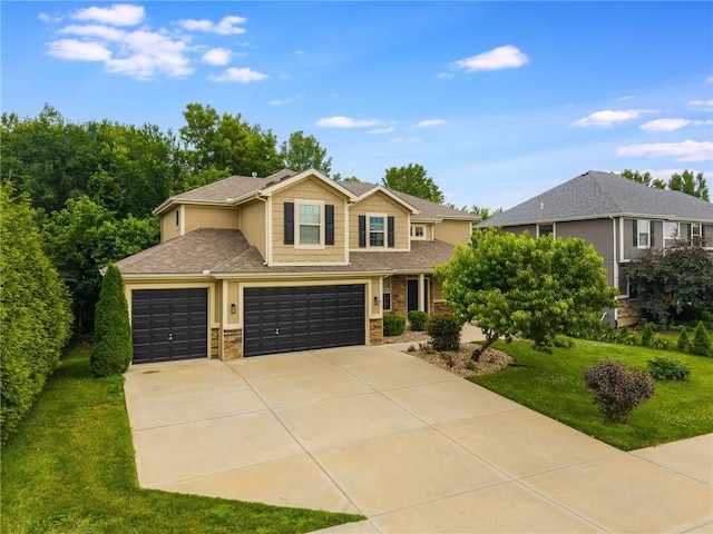 875 Clearview Dr, Lansing, KS 66043 - view of front of house with driveway, a front yard, stone siding, and a garage
