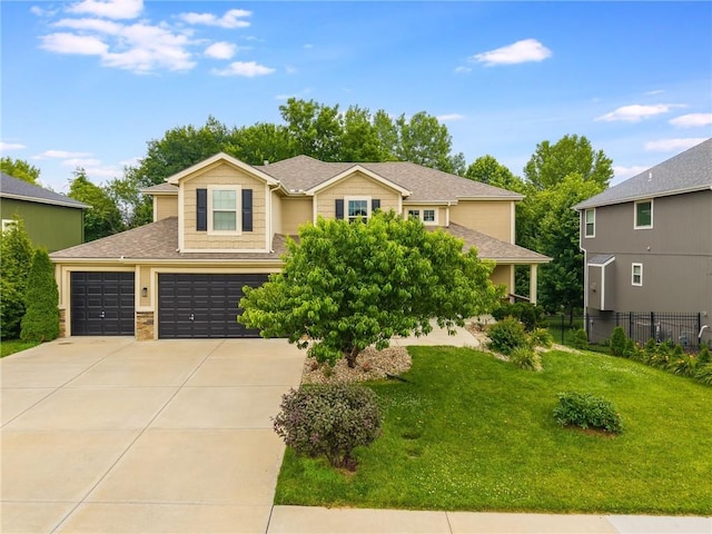 875 Clearview Dr, Lansing, KS 66043 - view of front of home with concrete driveway, a shingled roof, and a garage