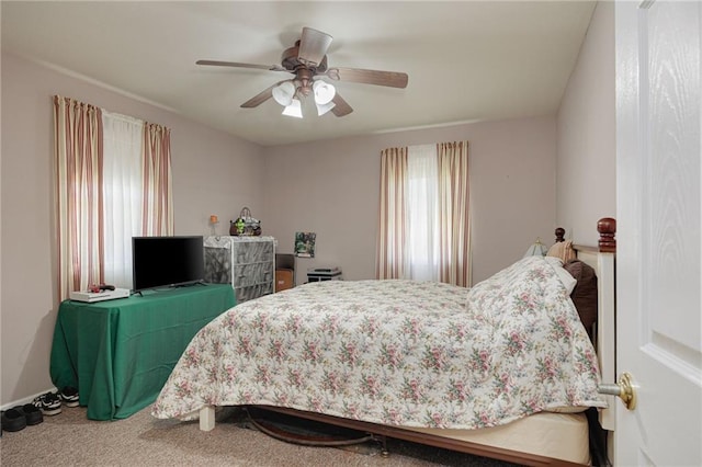 102 W Swenson Dr, Savannah, MO 64485 - carpeted bedroom featuring a ceiling fan