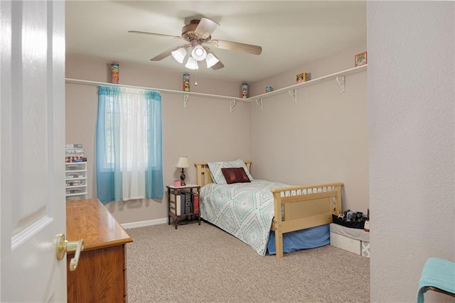 102 W Swenson Dr, Savannah, MO 64485 - carpeted bedroom with a ceiling fan