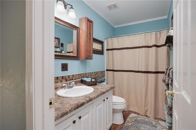 102 W Swenson Dr, Savannah, MO 64485 - full bathroom with toilet, vanity, ornamental molding, decorative backsplash, and wood finished floors