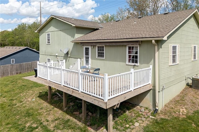 102 W Swenson Dr, Savannah, MO 64485 - rear view of house with a shingled roof, a wooden deck, and cooling unit