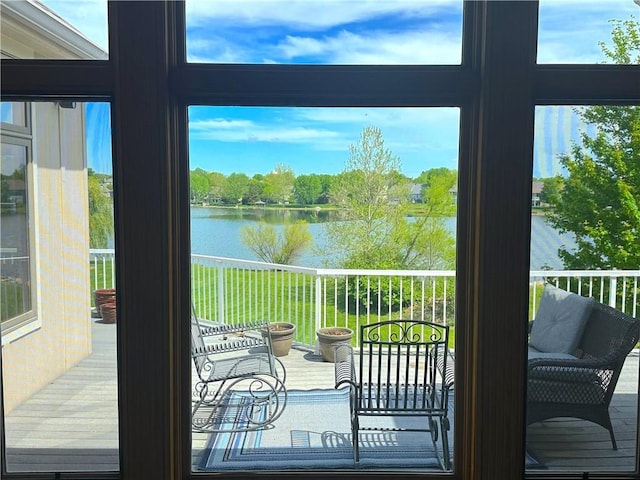 entryway featuring a water view and plenty of natural light