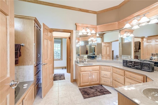 bathroom featuring ornamental molding, vanity, healthy amount of natural light, and tile patterned flooring
