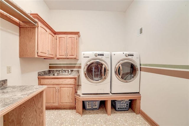 laundry area with cabinet space and washer and dryer