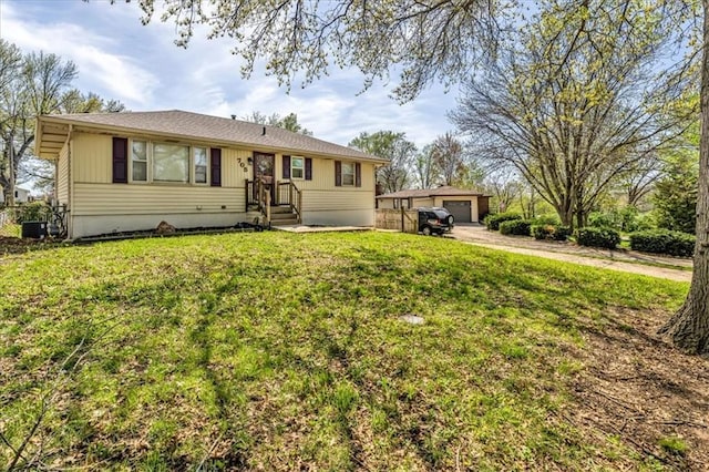 705 NW 88th Ter, Kansas City, MO 64155 - view of front of property with driveway, an outdoor structure, a front yard, and a garage
