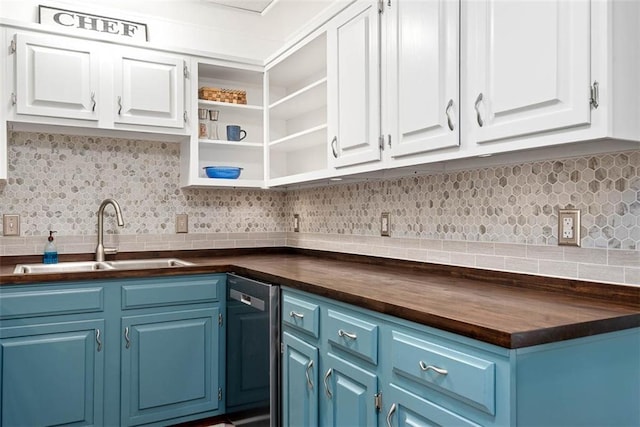 588 NW 105th Rd, Centerview, MO 64019 - kitchen with dishwashing machine, a sink, blue cabinetry, and white cabinetry