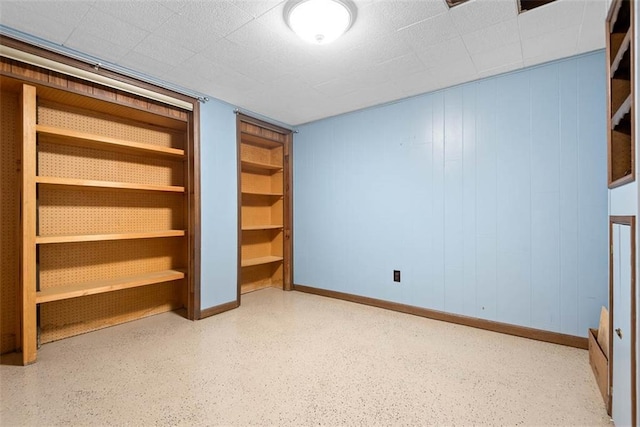 588 NW 105th Rd, Centerview, MO 64019 - unfurnished bedroom featuring baseboards and speckled floor