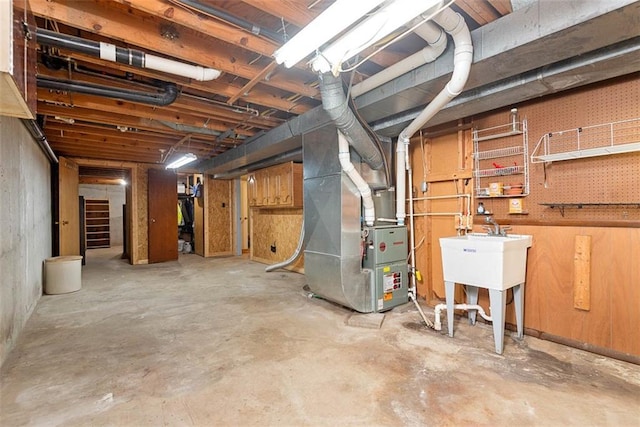 588 NW 105th Rd, Centerview, MO 64019 - unfinished below grade area featuring heating unit and a sink