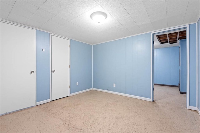 588 NW 105th Rd, Centerview, MO 64019 - unfurnished bedroom featuring baseboards, a closet, and speckled floor