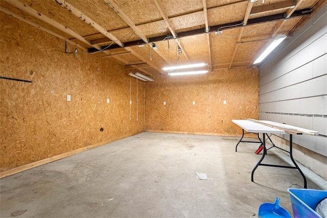 588 NW 105th Rd, Centerview, MO 64019 - miscellaneous room featuring a garage and unfinished concrete flooring