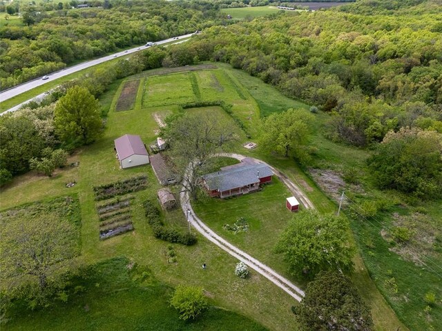 588 NW 105th Rd, Centerview, MO 64019 - aerial view of property's location with rural landscape and a forest