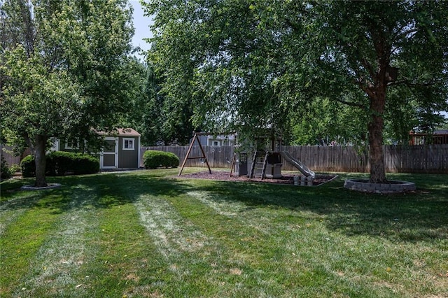 3616 Anchor Ct, Blue Springs, MO 64015 - fenced backyard featuring a playground and a storage unit