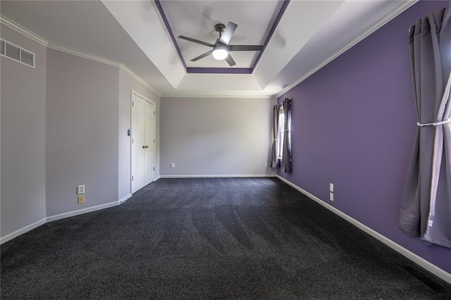 3616 Anchor Ct, Blue Springs, MO 64015 - empty room featuring ceiling fan, a tray ceiling, dark carpet, and ornamental molding