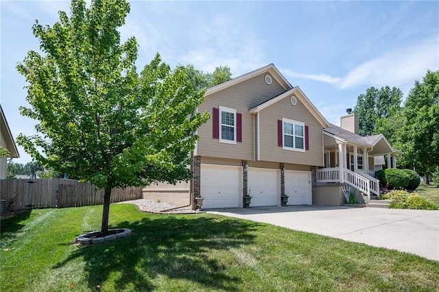 3616 Anchor Ct, Blue Springs, MO 64015 - view of front of property featuring a garage, driveway, and a chimney