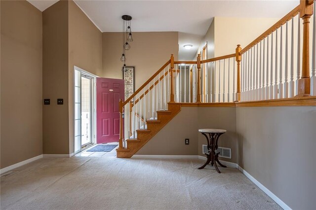 3616 Anchor Ct, Blue Springs, MO 64015 - carpeted foyer featuring a high ceiling and stairs