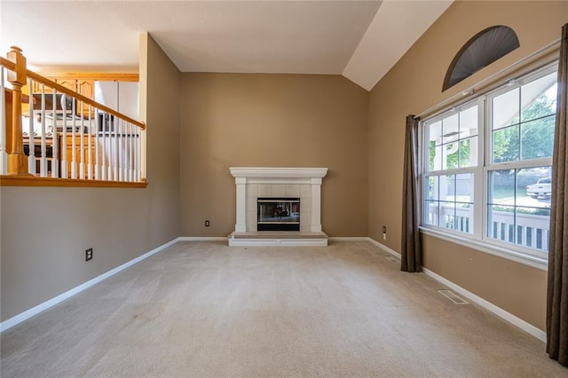 3616 Anchor Ct, Blue Springs, MO 64015 - unfurnished living room with carpet, vaulted ceiling, and a fireplace