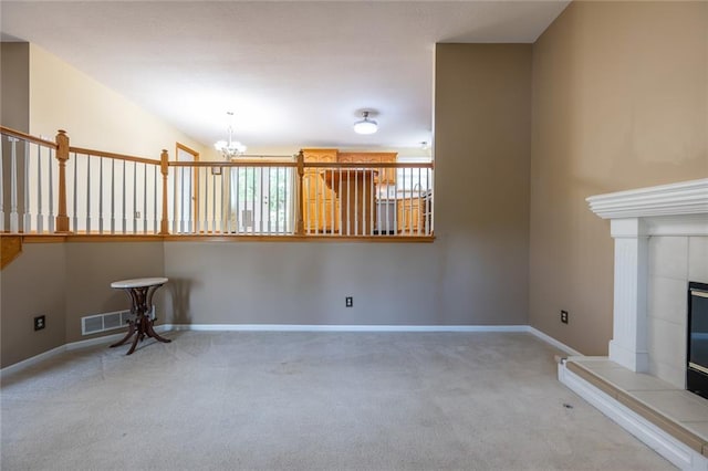 3616 Anchor Ct, Blue Springs, MO 64015 - unfurnished living room featuring a chandelier, carpet flooring, and a fireplace