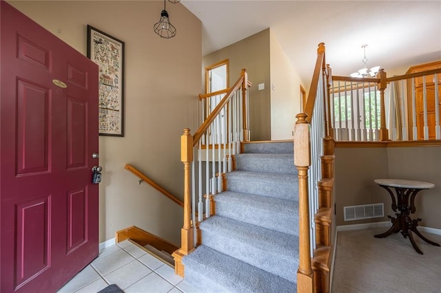 3616 Anchor Ct, Blue Springs, MO 64015 - entryway with a chandelier, carpet floors, stairs, and tile patterned flooring