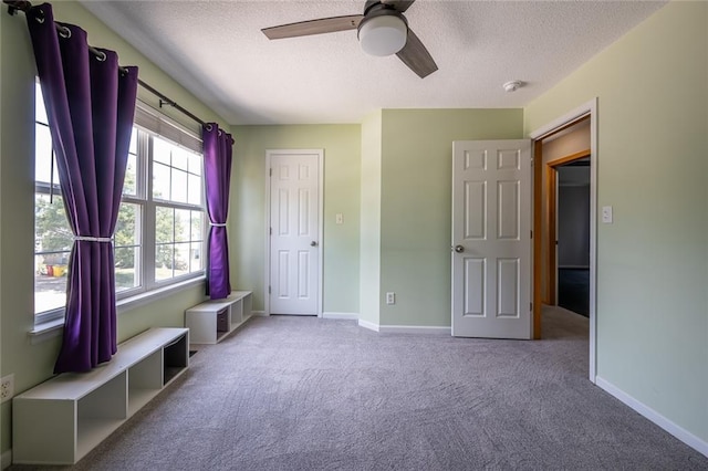 3616 Anchor Ct, Blue Springs, MO 64015 - unfurnished bedroom featuring a textured ceiling, carpet flooring, and ceiling fan