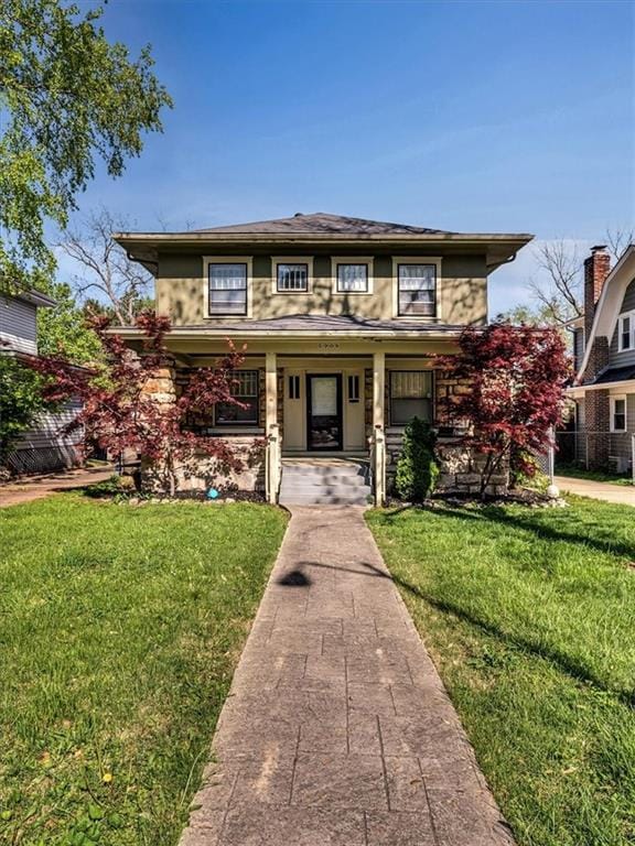5909 Wornall Rd, Kansas City, MO 64113 - view of front of home featuring a porch and a front lawn